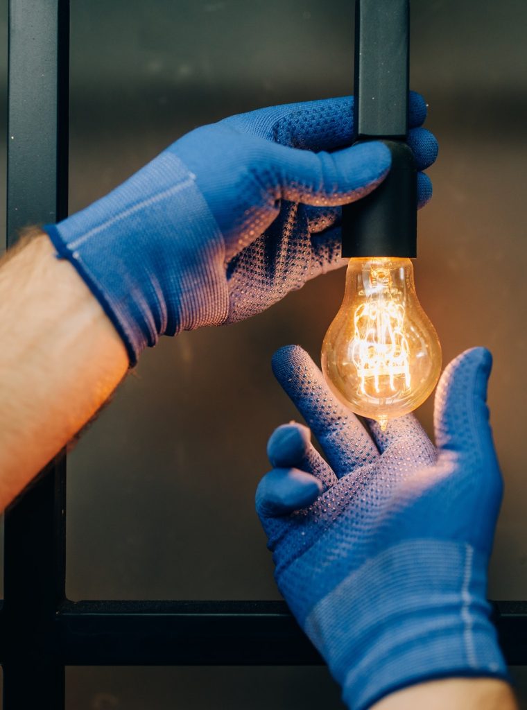 electrician-changes-the-light-bulb-handyman.jpg electrician-changes-the-light-bulb-handyman.jpg
