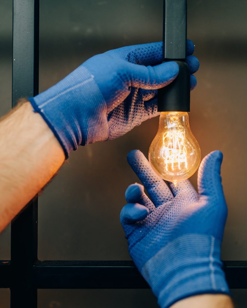 electrician-changes-the-light-bulb-handyman.jpg electrician-changes-the-light-bulb-handyman.jpg